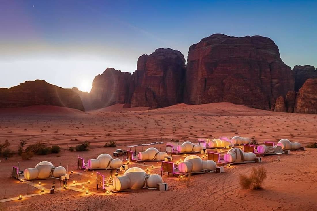 Exclusive luxury tours and events in Jordan with luxury desert bubble camp in Wadi Rum under sandstone cliffs by Chaya Voyages.