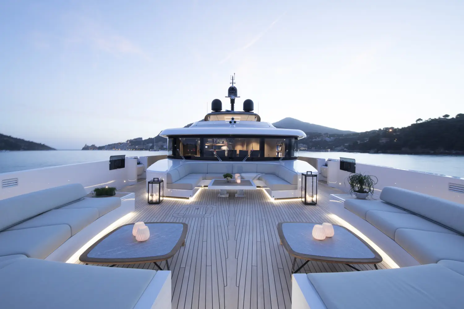 Luxury yacht deck at sunset prepared for an exclusive voyage – bespoke cruises and private events by Chaya Voyages, a luxury travel agency in Chicago.
