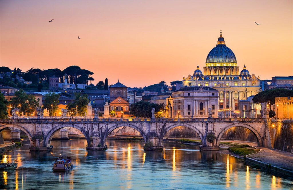 View of St. Peter’s Basilica and bridge in Rome at sunset – cultural inspiration for exclusive luxury tours and events by Chaya Voyages.